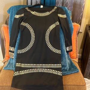 Beautiful Miken dress with detailed metallic designs. Elegant for a Xmas party.